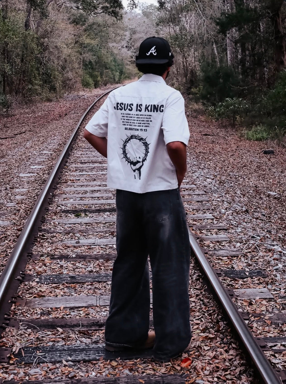 Jesus Is King Boxy Shirt from behind — JESUS IS KING and a crown of thorns across the back
